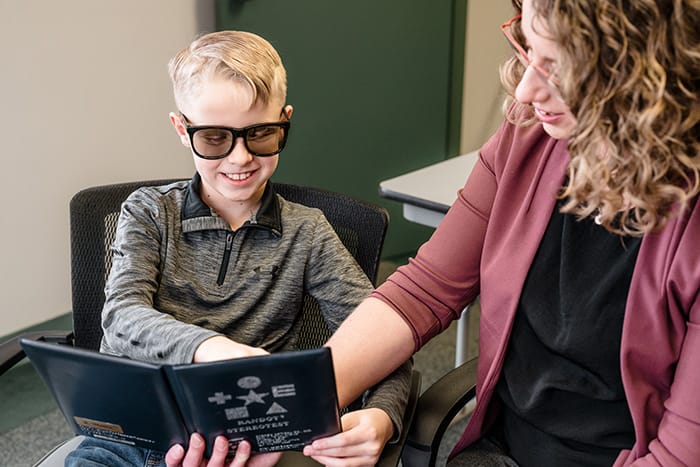 Child and doctor during eye exam.